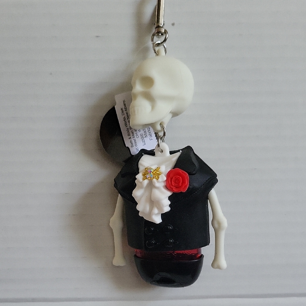 Skeleton Keychain with Black Suit and Red Rose, Bath and Body Works. Glows